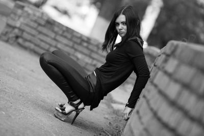 Portrait of woman sitting outdoors