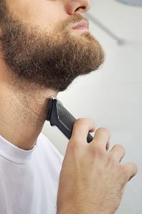 Close-up of man holding camera