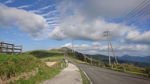 Empty road along countryside landscape