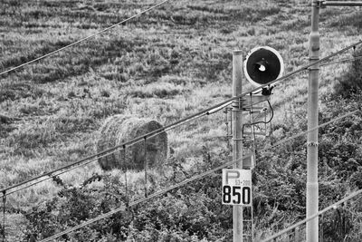 Road sign on field