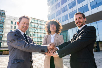 Business colleagues shaking hands in city