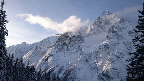 Low angle view of snow covered mountain peak