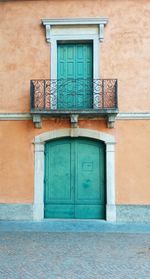 Green door in a storic facade