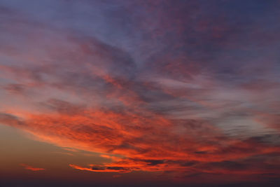 Low angle view of dramatic sky during sunset