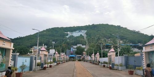 Street amidst buildings against sky