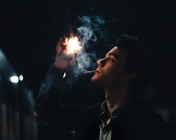 Portrait of man smoking cigarette