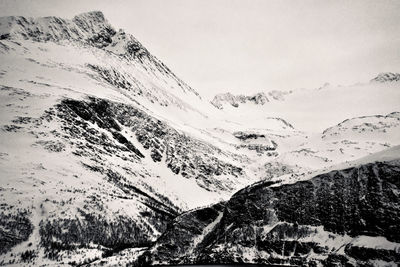 Scenic view of snow covered mountains against sky