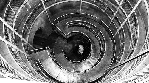 Directly below shot of spiral staircase of building