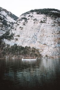 Scenic view of lake against snow covered mountain