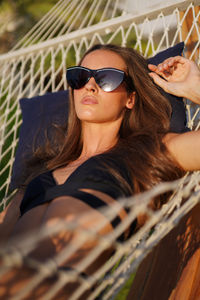 Woman relaxing in the hammock