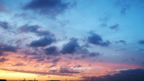 Low angle view of cloudy sky at sunset