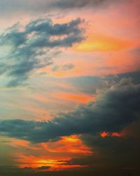 Low angle view of cloudy sky at sunset