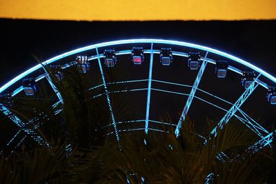 Low angle view of illuminated car windshield at night