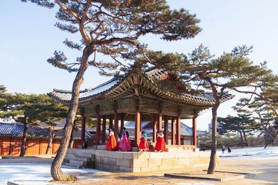 Gazebo in temple against sky in city