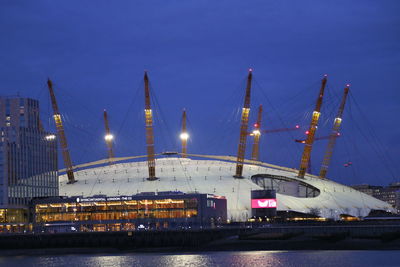 Illuminated commercial dock against clear sky at night