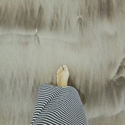 Low section of woman standing outdoors