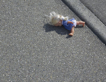 High angle view of doll on street