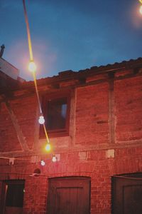 Low angle view of illuminated street light