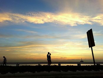 Silhouette of people on beach