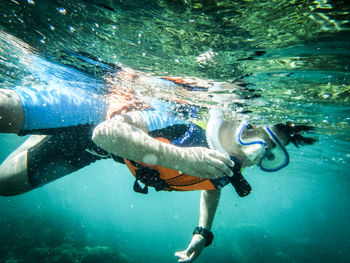 Woman swimming in sea