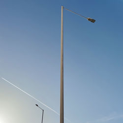 Low angle view of street light against clear blue sky