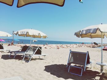 Scenic view of beach against blue sky