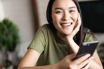 Young woman using mobile phone