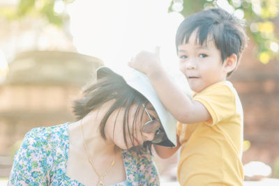 Portrait of mother and daughter outdoors