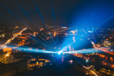 High angle view of illuminated buildings in city at night