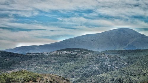 Landscape with mountain range in the background