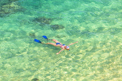 High angle view of woman snorkeling in sea