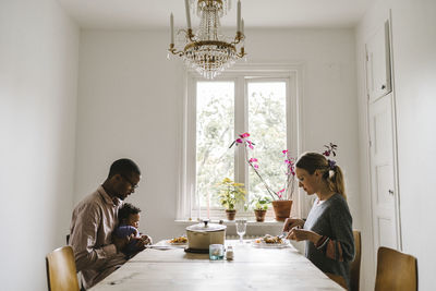 Parents with baby having meal