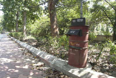 Information sign on tree in forest