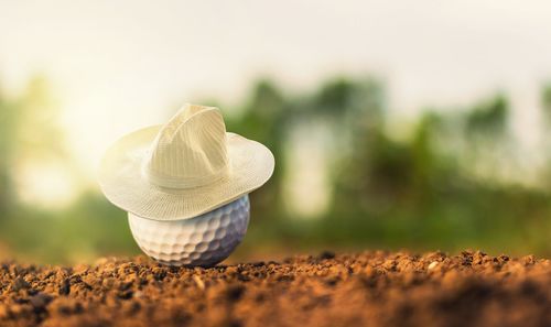 Close-up of hat on sand