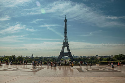 People at the trocadero and eiffel tower in paris. the famous capital of france.