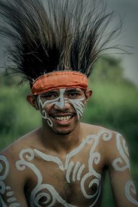 Close-up portrait of a smiling young man