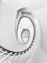 Directly below view of spiral staircase in building