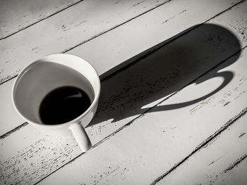 High angle view of coffee cup on table