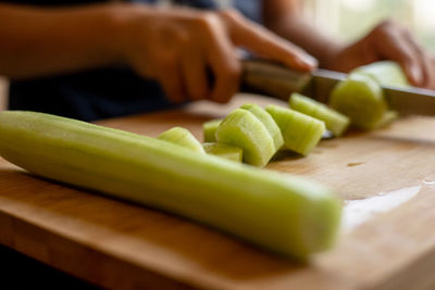 Cropped image of woman holding food