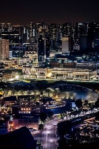 High angle view of illuminated city buildings at night