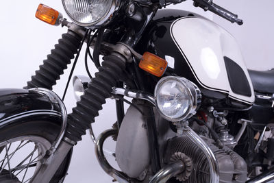 Close-up of motorcycle against white background