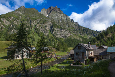 Scenic view of mountains against cloudy sky