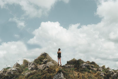 Rear view of woman standing on landscape