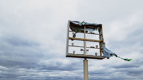 Broken sign after storm and the wind