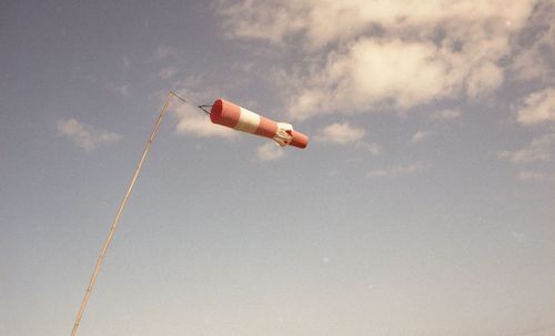 Low angle view of kite flying against sky