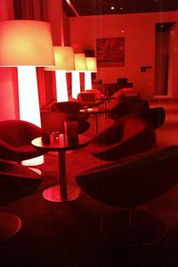 Close-up of empty benches in the dark