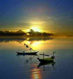 Silhouette boat in lake against sky during sunset