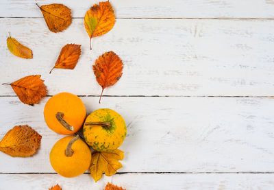 High angle view of orange leaves on table