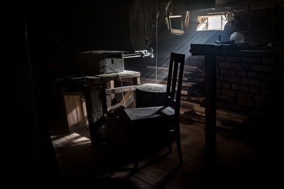 Chairs and tables in illuminated building