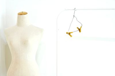 Close-up of yellow bottle against white background